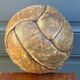 Mid-20th century leather soccer ball with visible stitching and beautiful patina