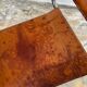 Vintage aluminum tube and tan leather armchair