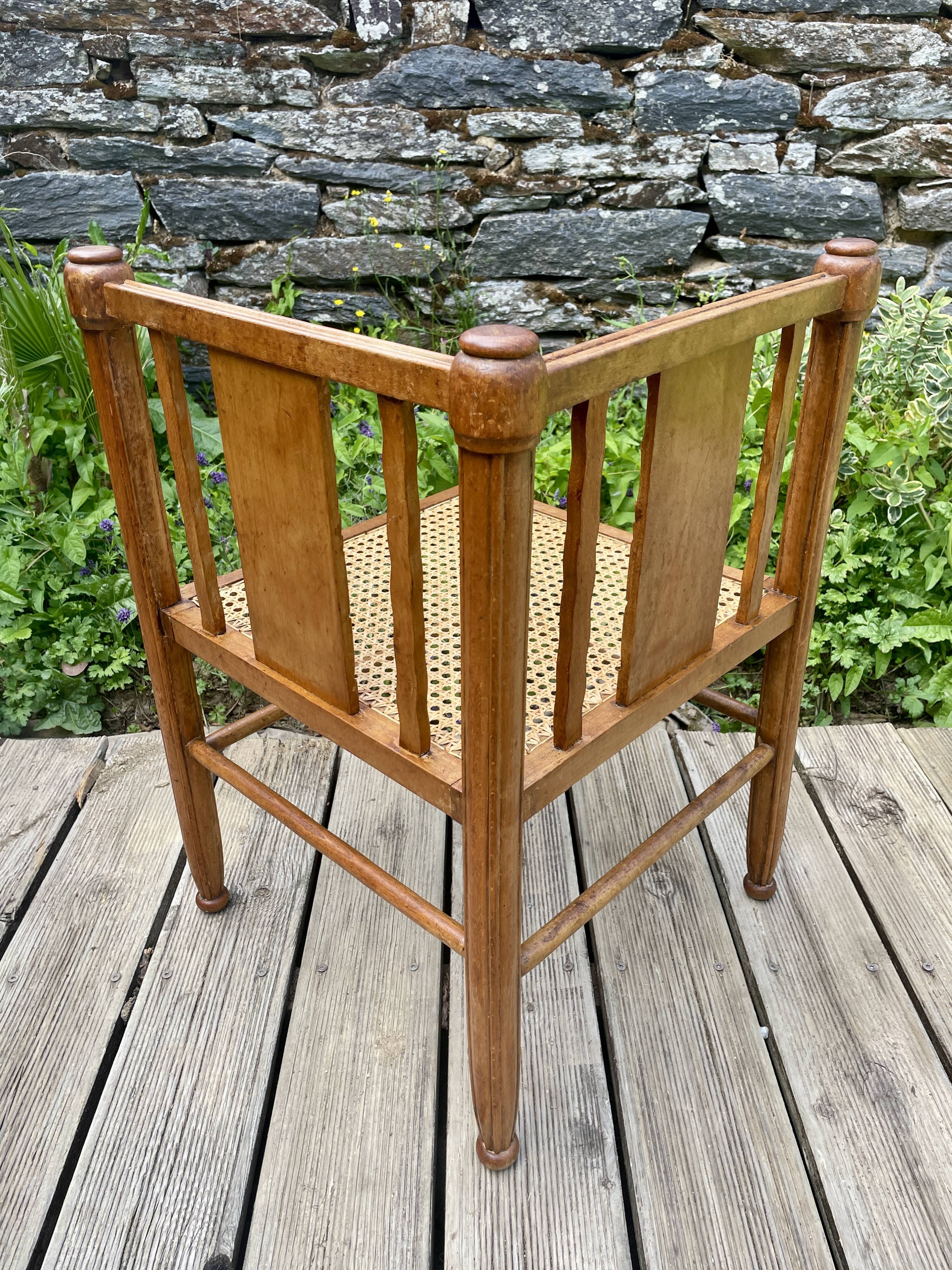 Art Deco corner chair with caning