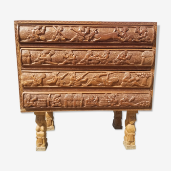 Compact 4-drawer ethnic chest of drawers carved with scenes of African life