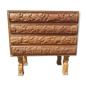 Compact 4-drawer ethnic chest of drawers carved with scenes of African life