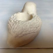 Bird candle holder for indoor or outdoor use.