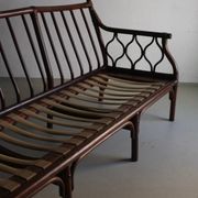 Dark rattan 3-seater sofa with red velour cushions | 1980s
