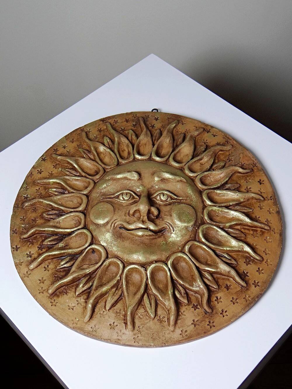 Anthropomorphic sun wall sculpture in patinated terracotta, vintage Italian craftsmanship.