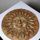 Anthropomorphic sun wall sculpture in patinated terracotta, vintage Italian craftsmanship.