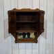 Early 20th-century English wall shelf in walnut.