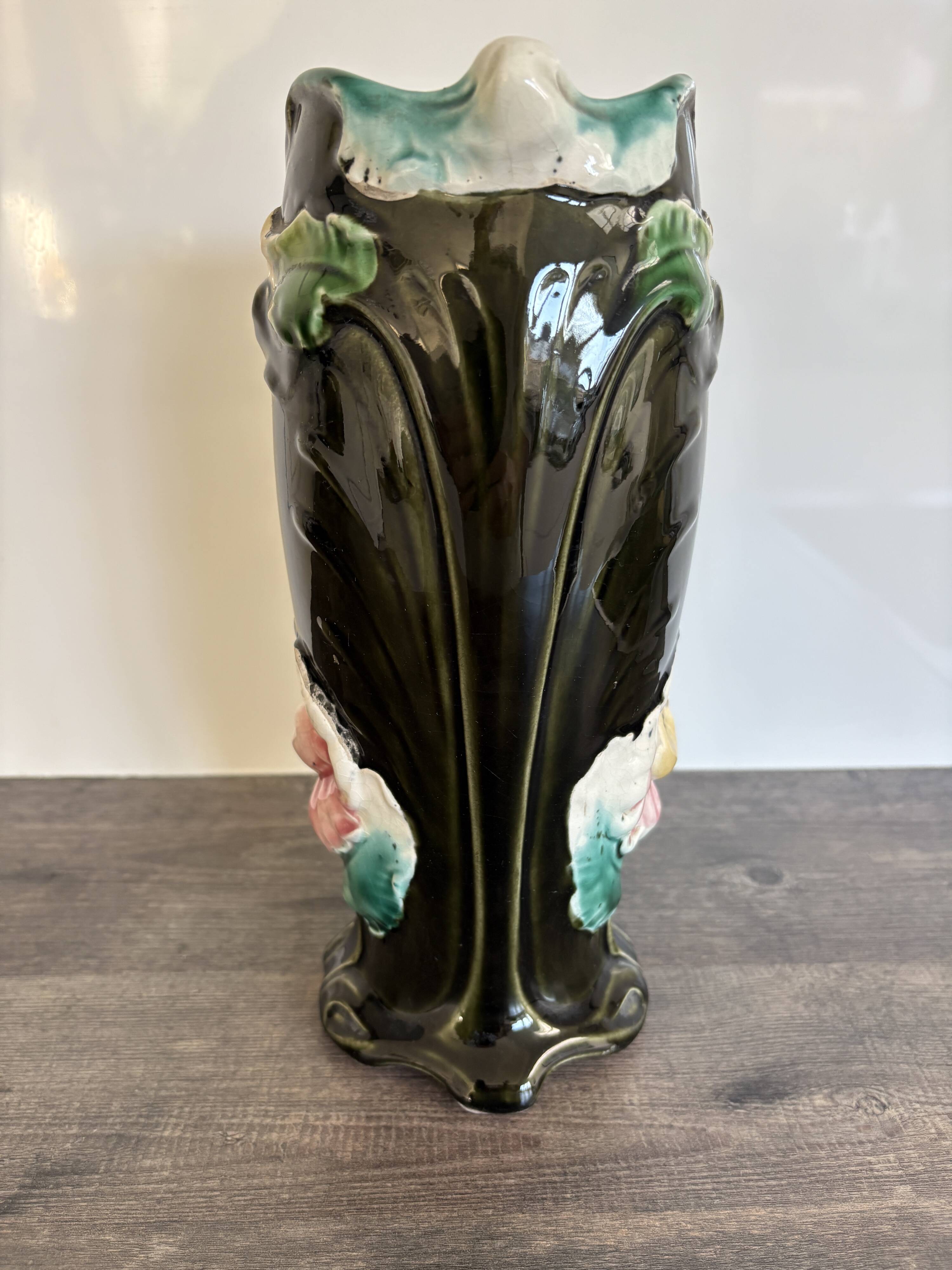 Antique ceramic vase by De Bruyn with floral decoration.