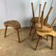 Set of 6 brutalist solid oak tripod farm stools from the 1950s