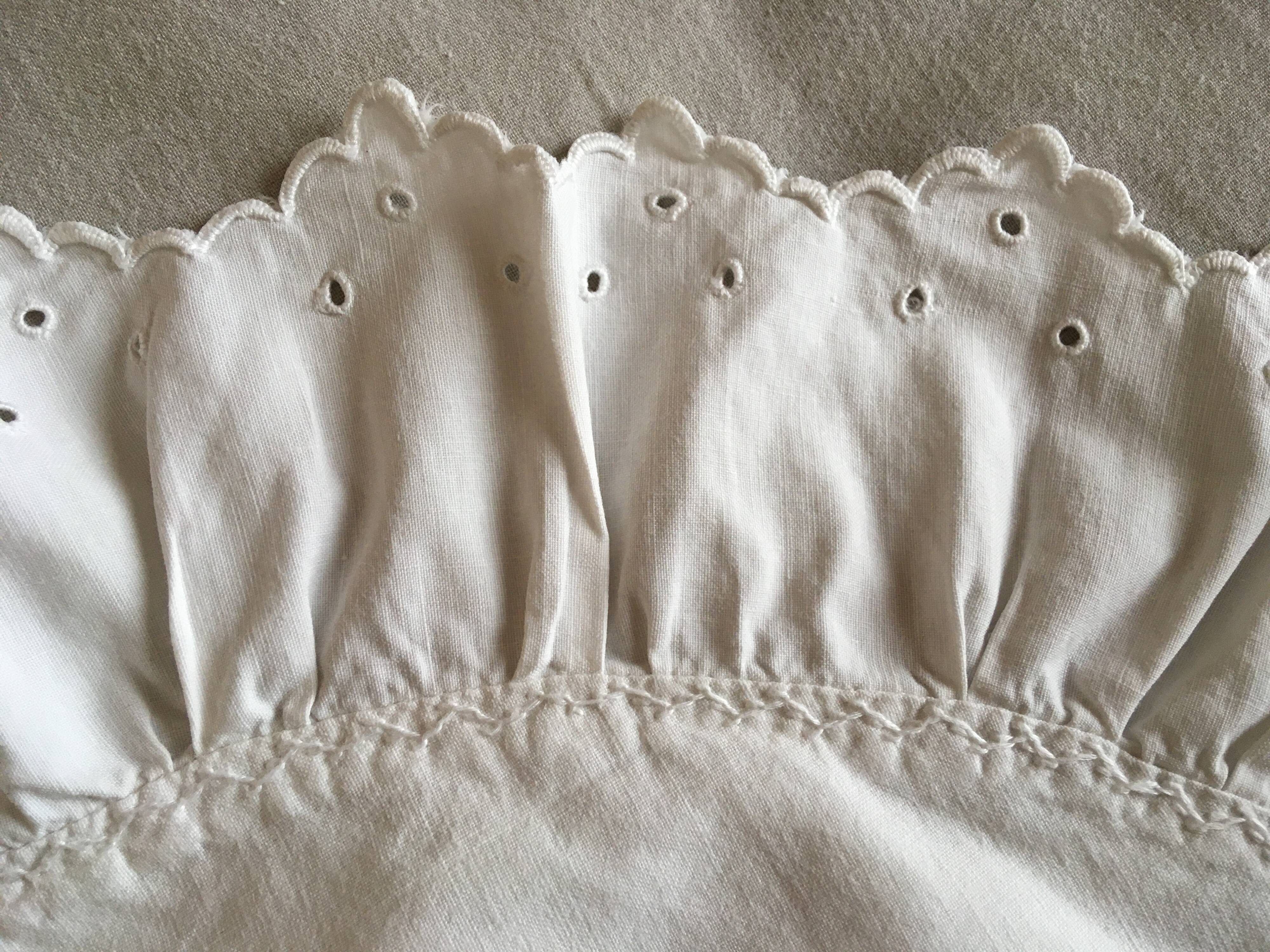 Two half-moon ruffled cushion covers