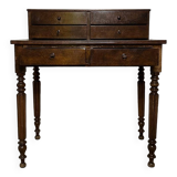 Wooden lady's desk says "happiness of the day"