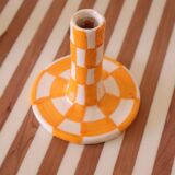 Pair of yellow and white checkered ceramic candlesticks