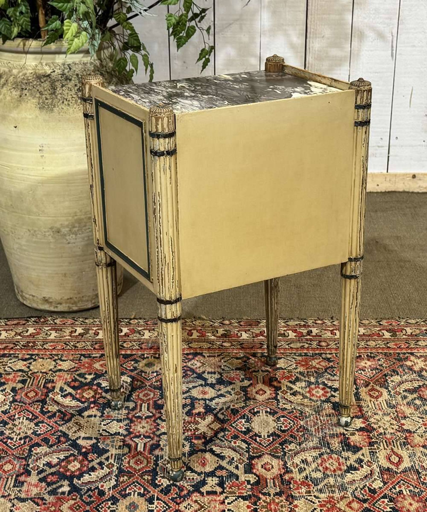 Beech bedside table painted with a marble top in Louis XVI style from the late 19th century.