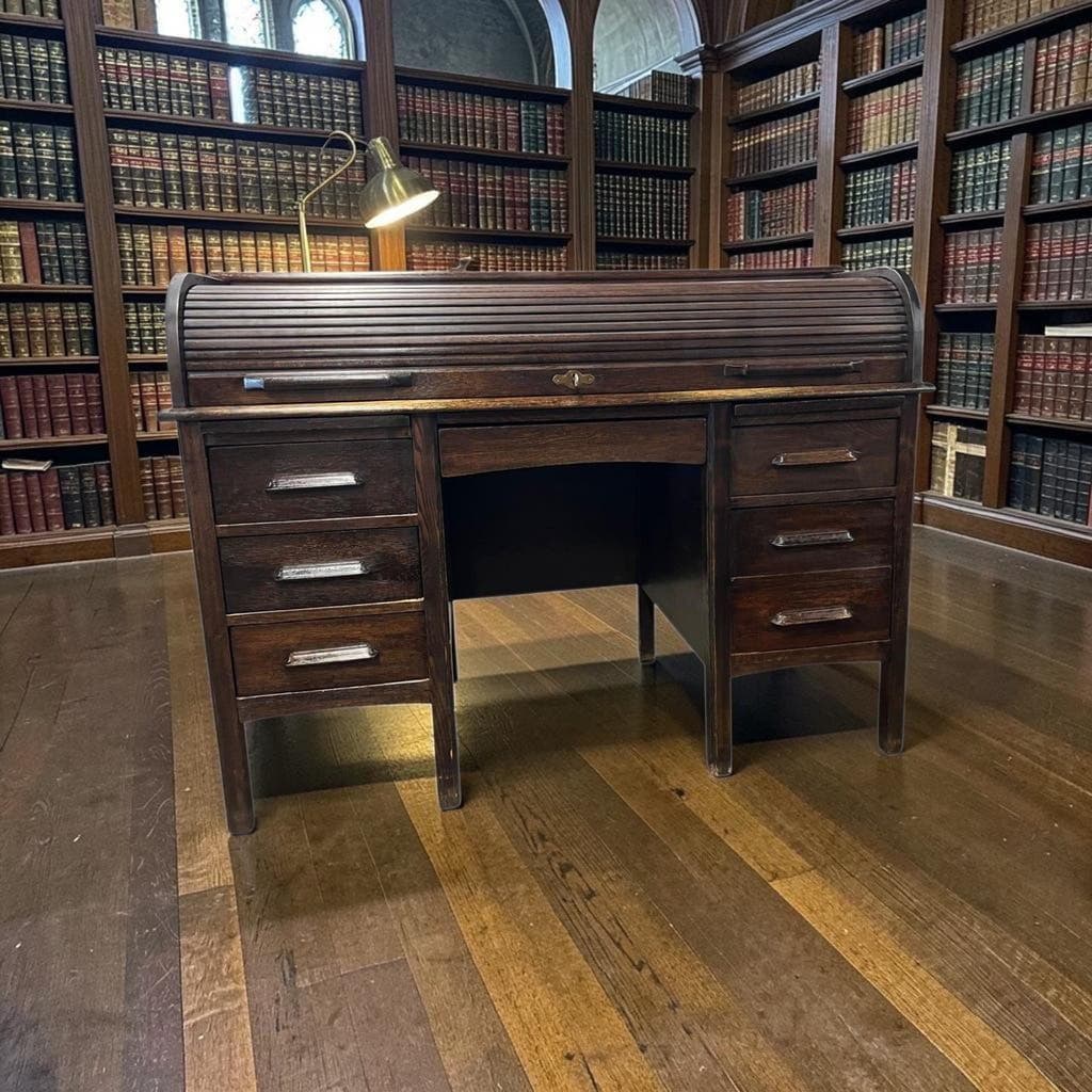 Vintage American wooden desk with a roll-top.