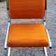 Pair of designer armchairs in orange fabrics and chrome tubes from the 70s
