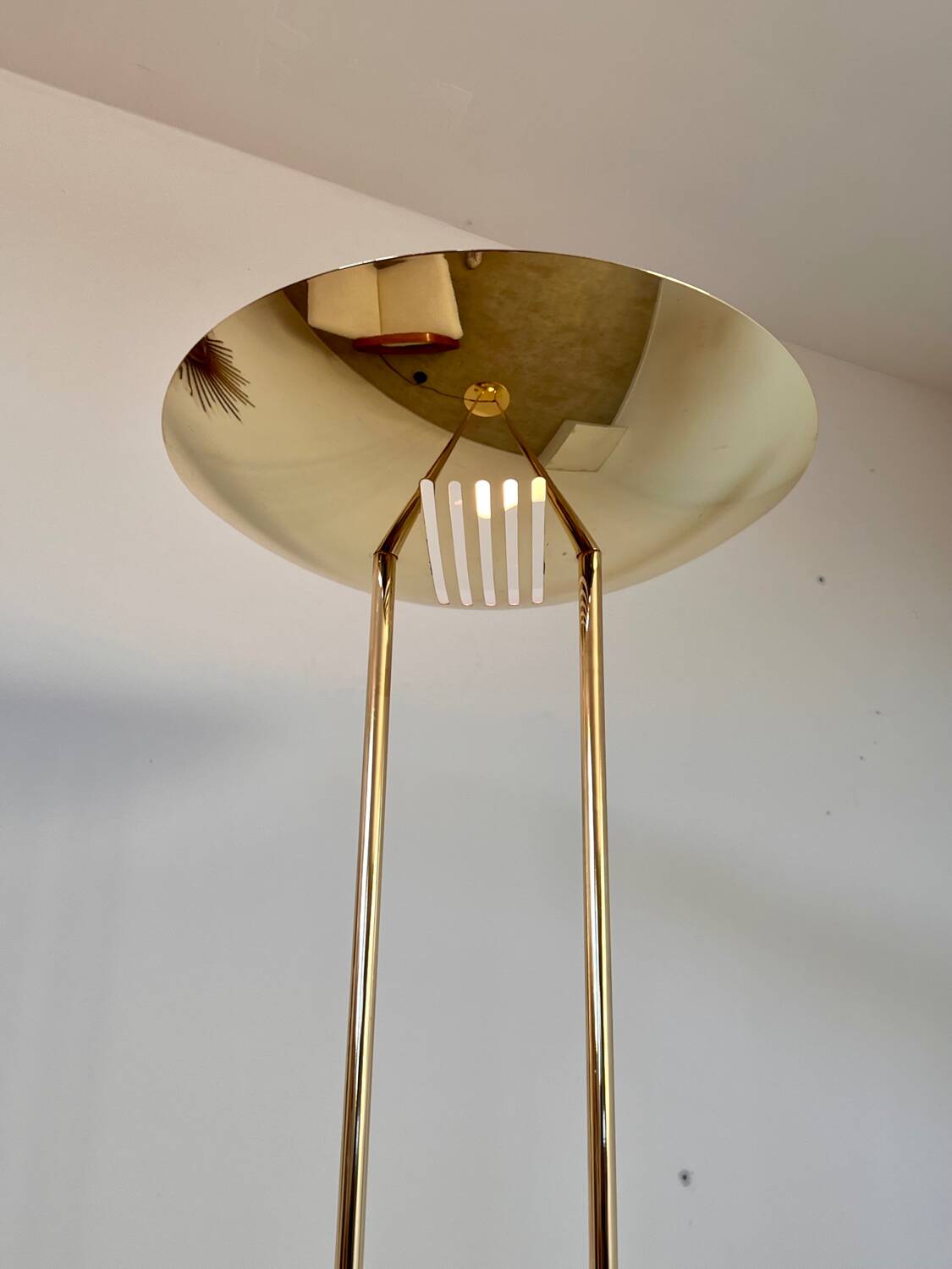 Old golden brass floor lamp with Italian design bulb from the 70s vintage