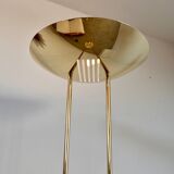 Old golden brass floor lamp with Italian design bulb from the 70s vintage