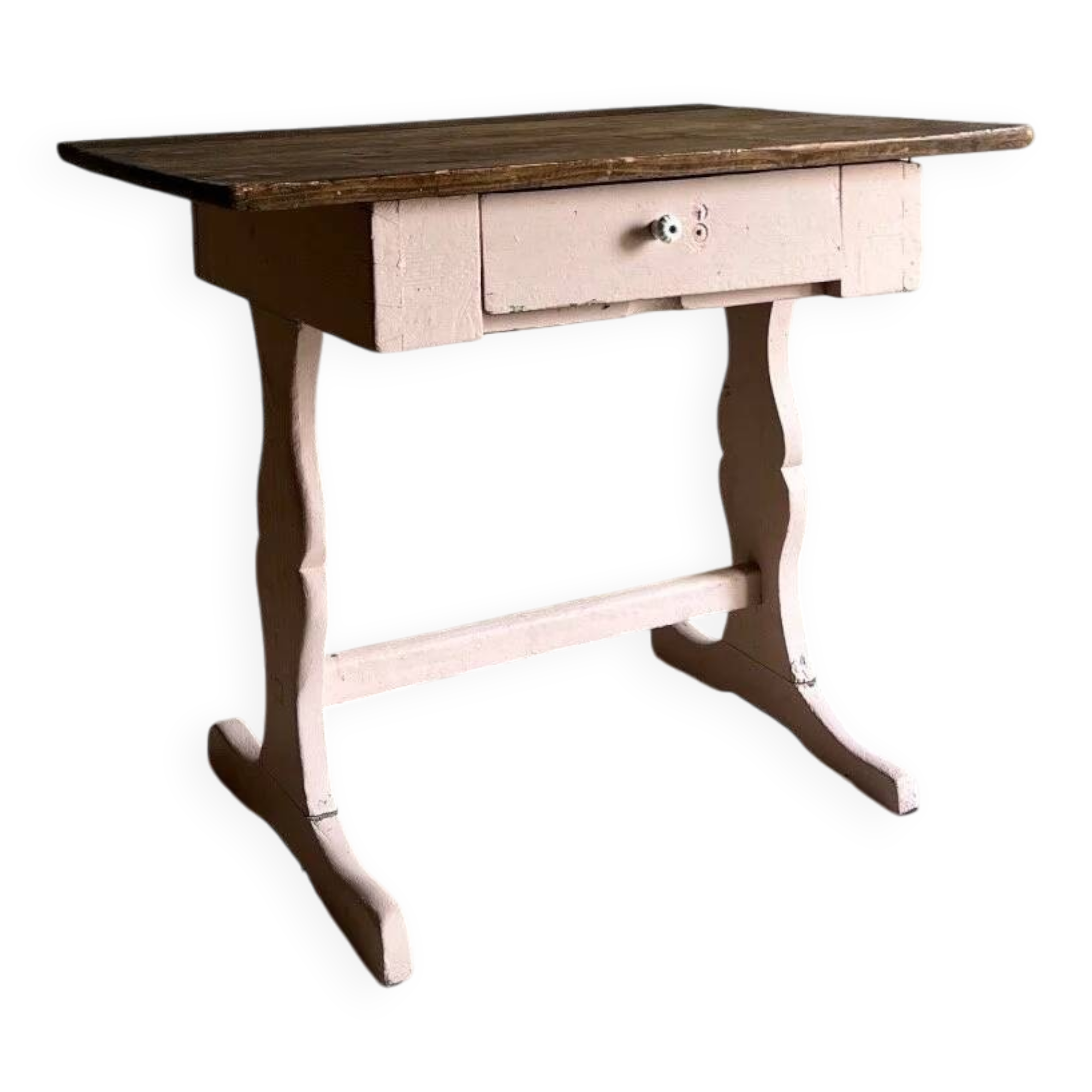 Rustic pink painted desk with brown tabletop