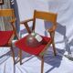 Pair of wooden armchairs and skaï foot compass of the 50s