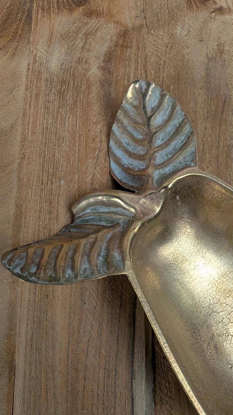 Small vintage brass trinket dish in the shape of a pear.