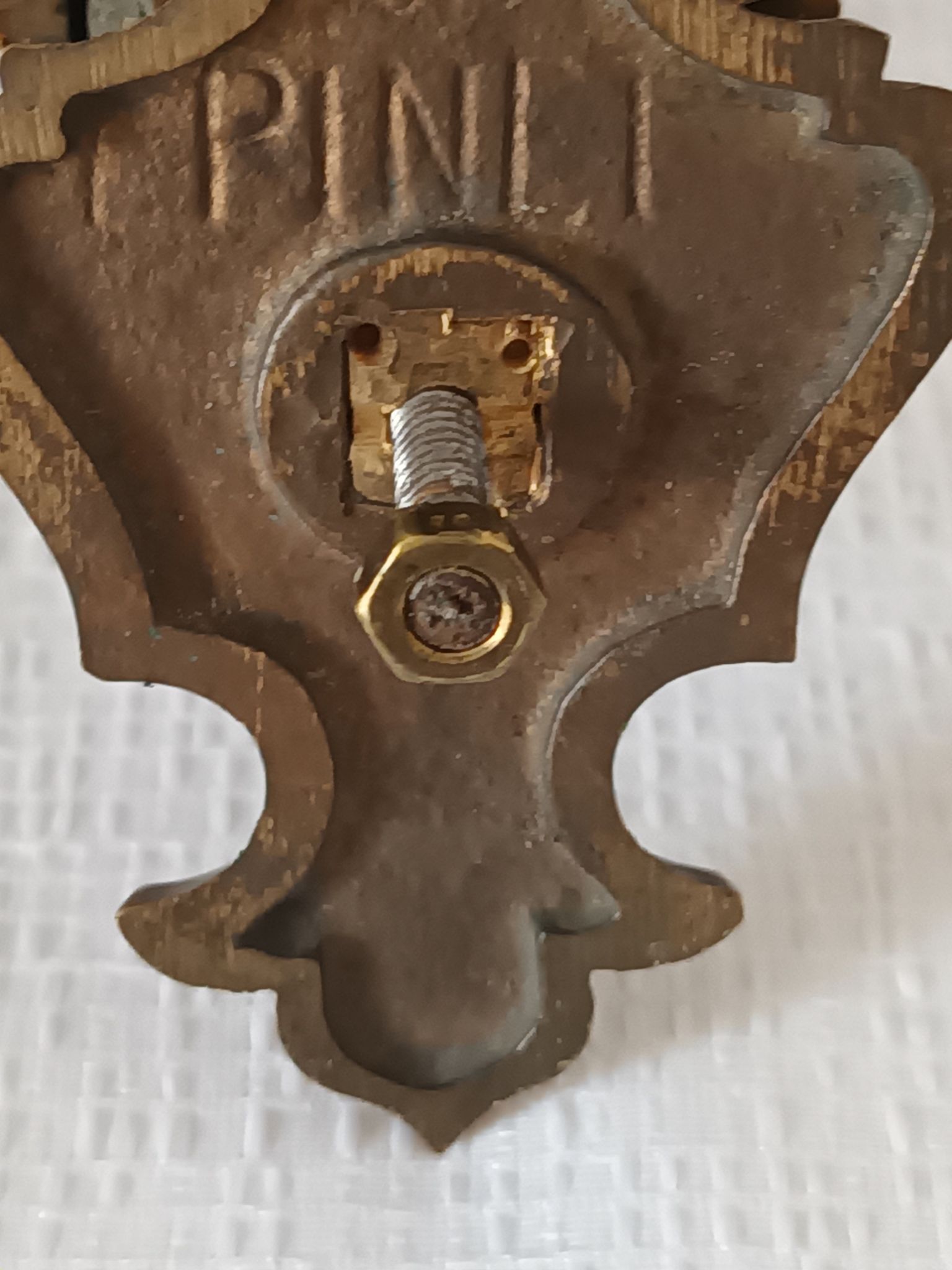 Pair of antique wall-mounted brass candle holders