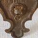 Pair of antique wall-mounted brass candle holders