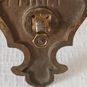 Pair of antique wall-mounted brass candle holders