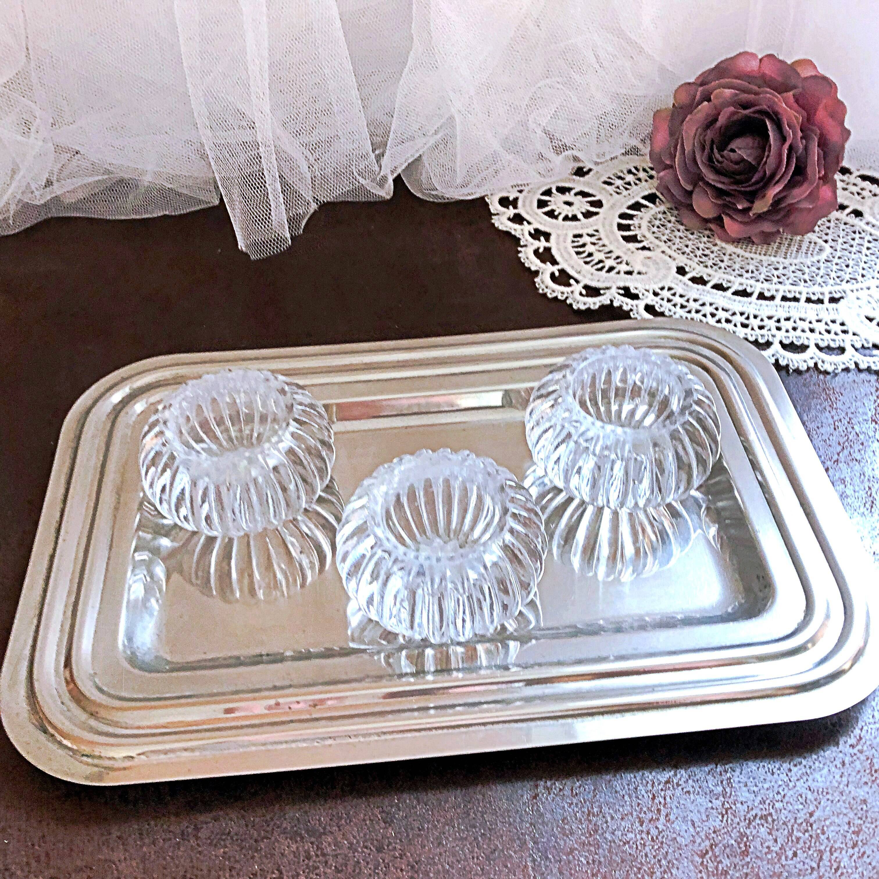 Trio of salt shakers, pepper shakers, molded glass salt shakers