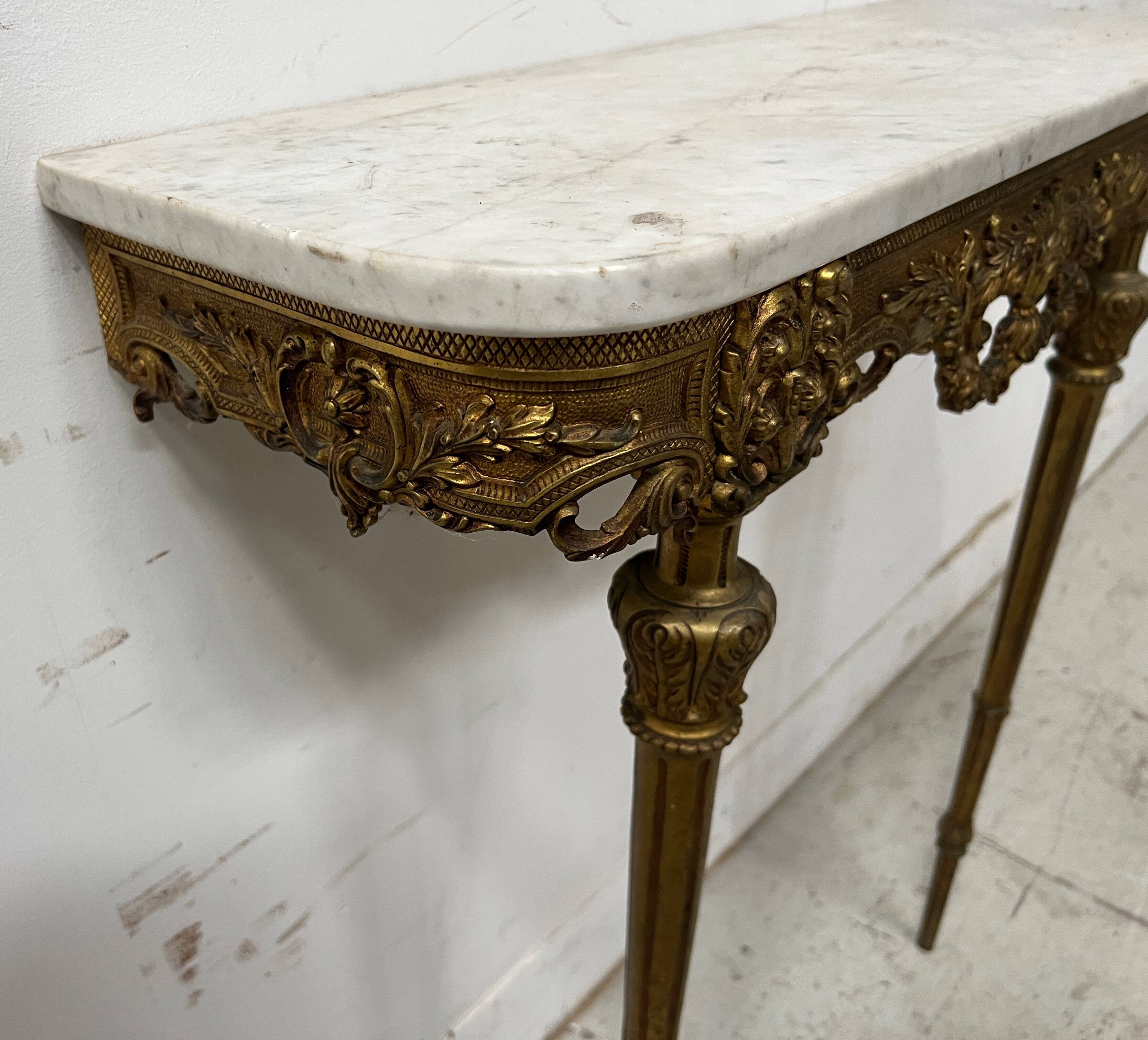 Louis XVI style console in chiselled bronze, 20th century.
