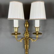 Set of three Louis XVI style wall sconces in gilded bronze, 20th century.