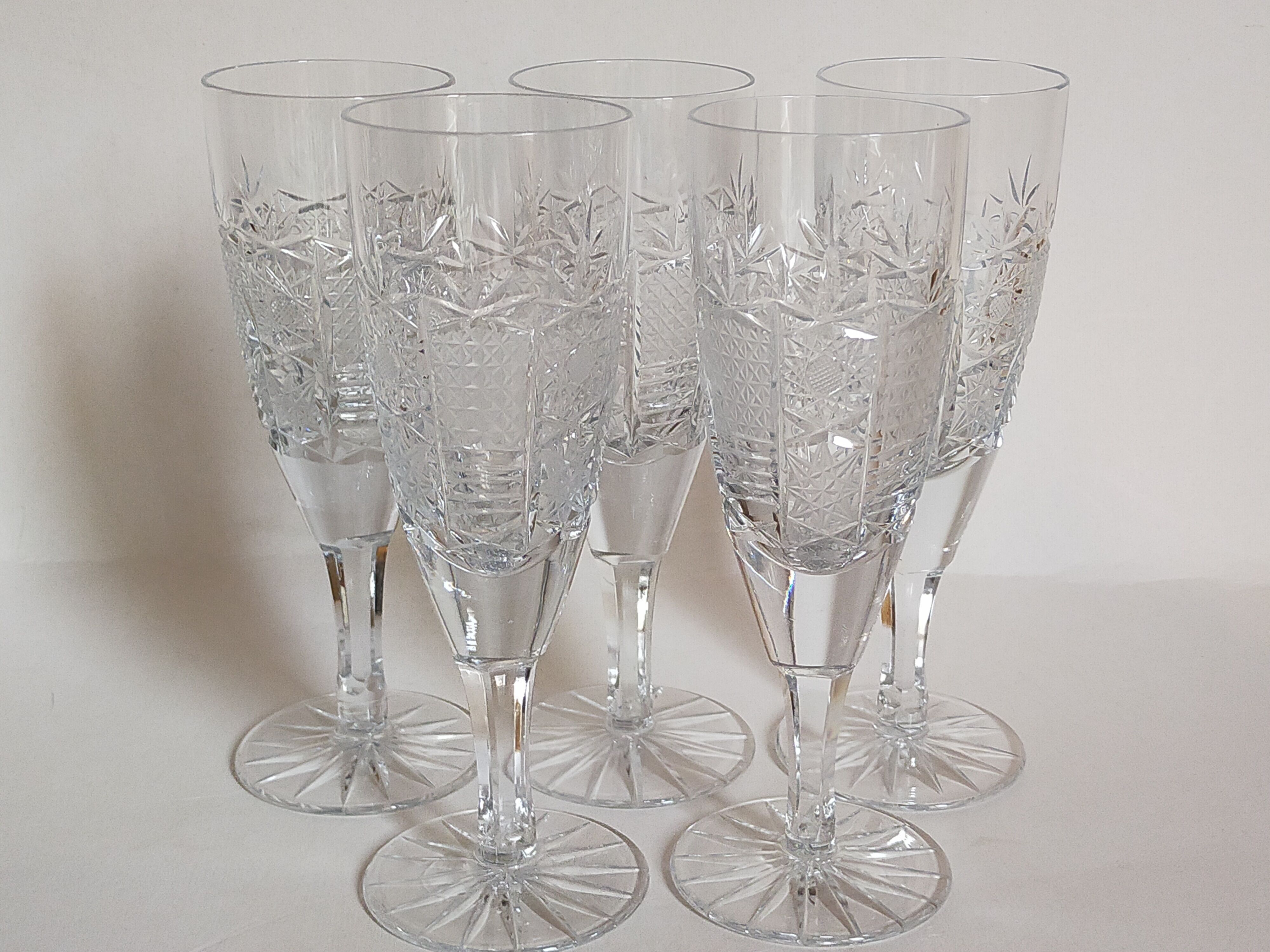 Five vintage cut crystal champagne flutes