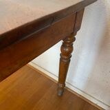 Walnut bistro table, feet turned.