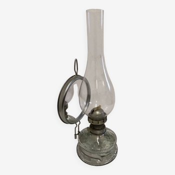 Old glass oil lamp with its mirror