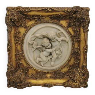 Group of cherubs in gilded wood frame