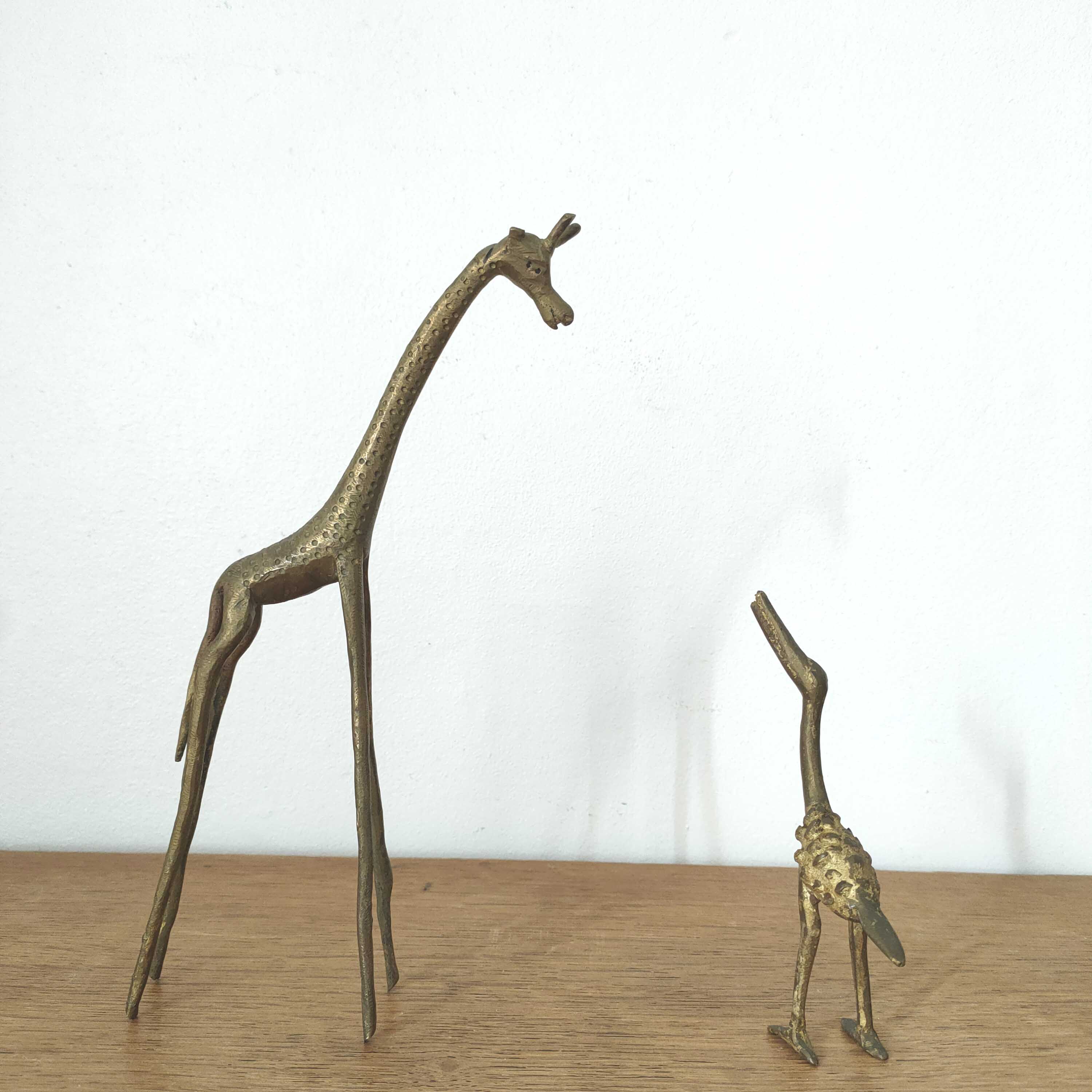 Giraffe and brass bird