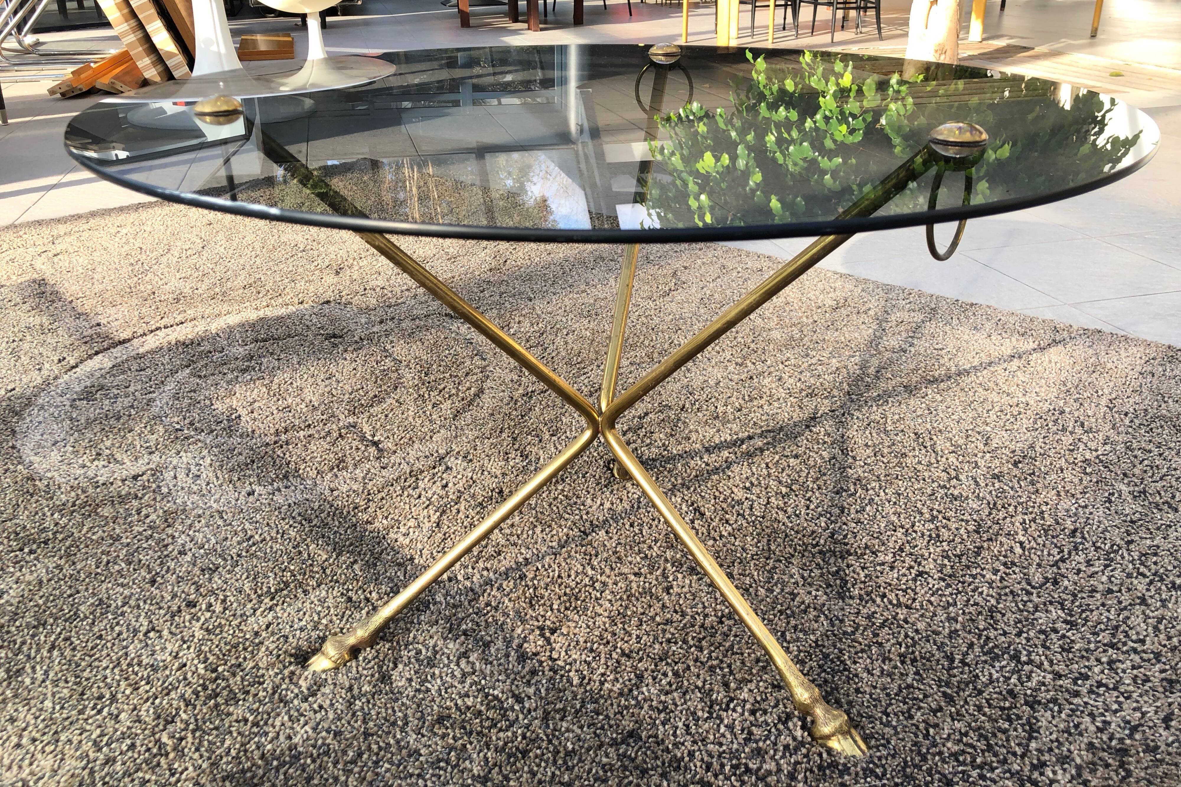 Glass and brass coffee table with hoof-shaped tripod legs, 1970