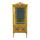 Carved and gilded wooden display cabinet, Louis XVI style, 20th century.