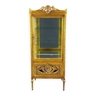 Carved and gilded wooden display cabinet, Louis XVI style, 20th century.