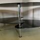 Vintage triple coffee table with smoked glass and chrome top