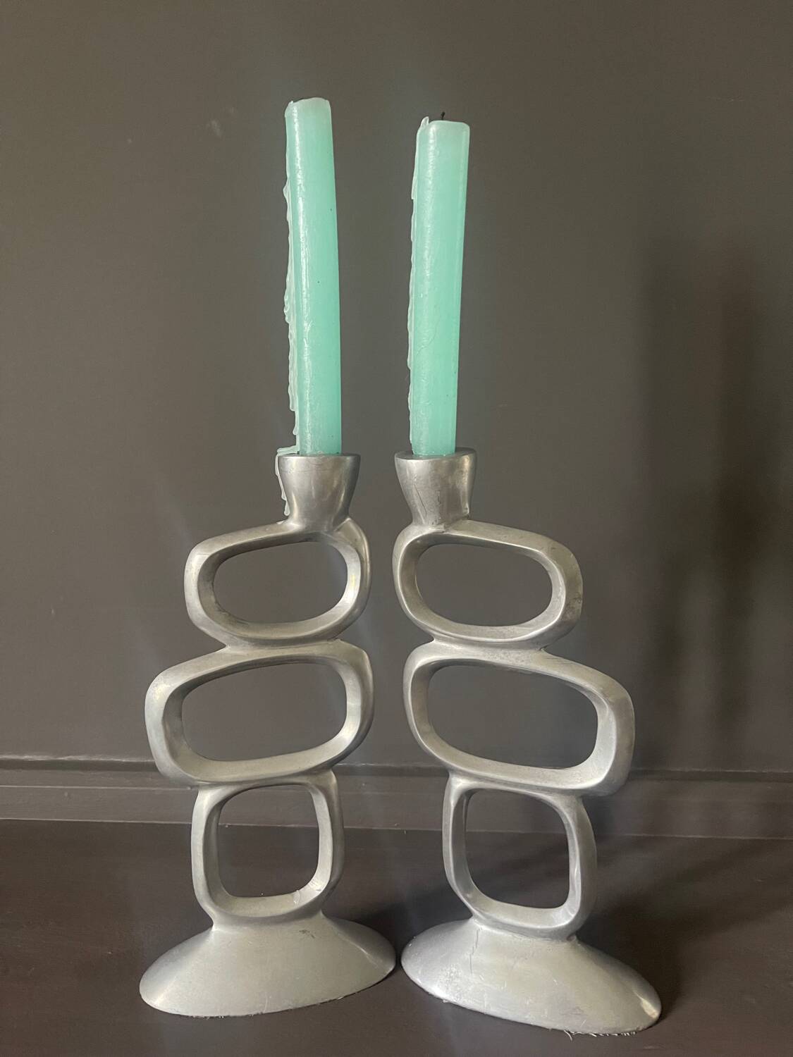 Pair of aluminum candlesticks