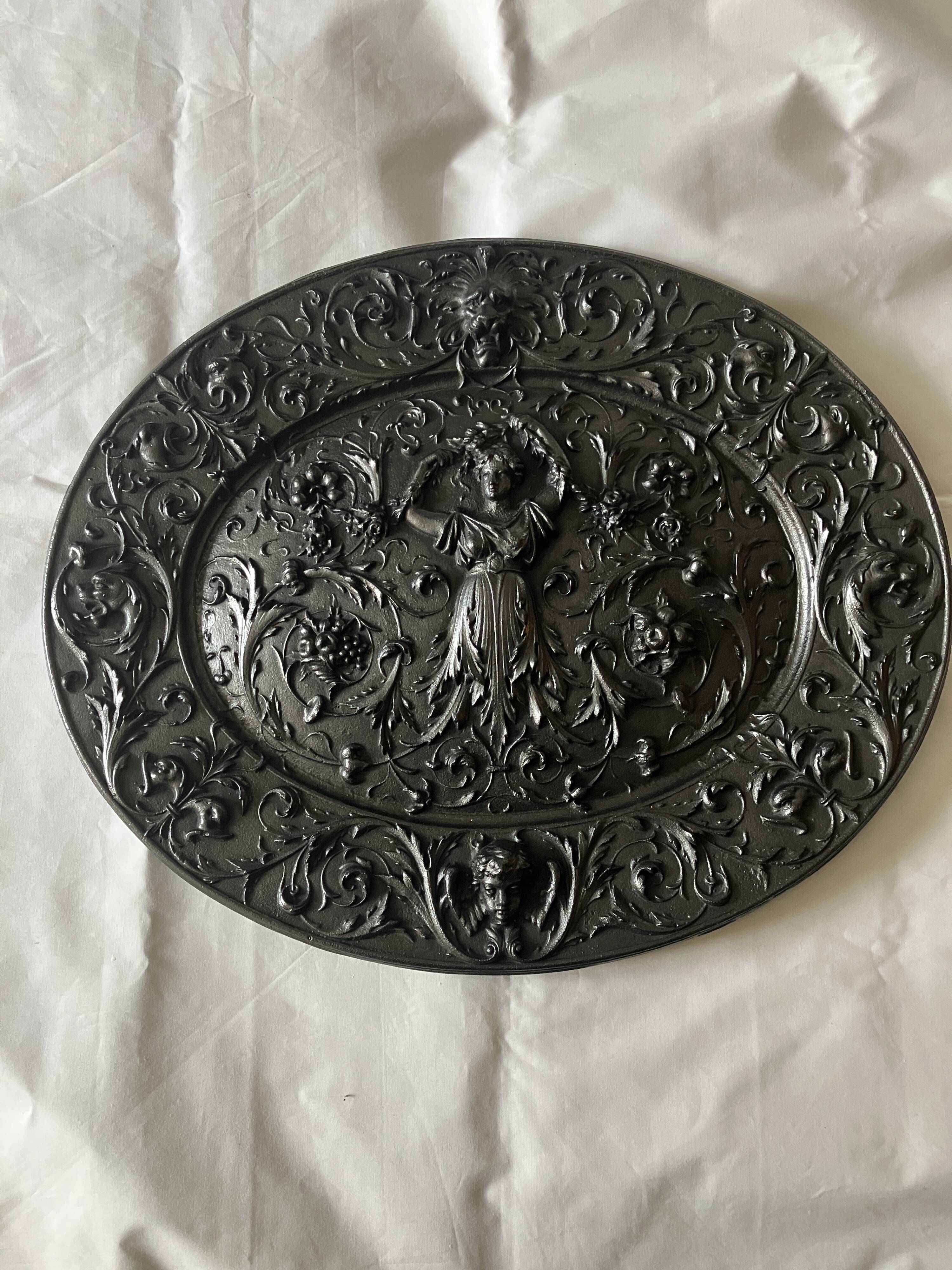 Plaque décorative en fonte début 20°siècle.