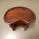 Antique walnut coffee table with decorations, Italy, 19th century.
