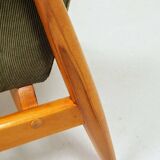 Mid-century modern design armchair in olive green corduroy.