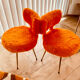 Pair of Pelfran chairs in faux orange, 1960s-70s.