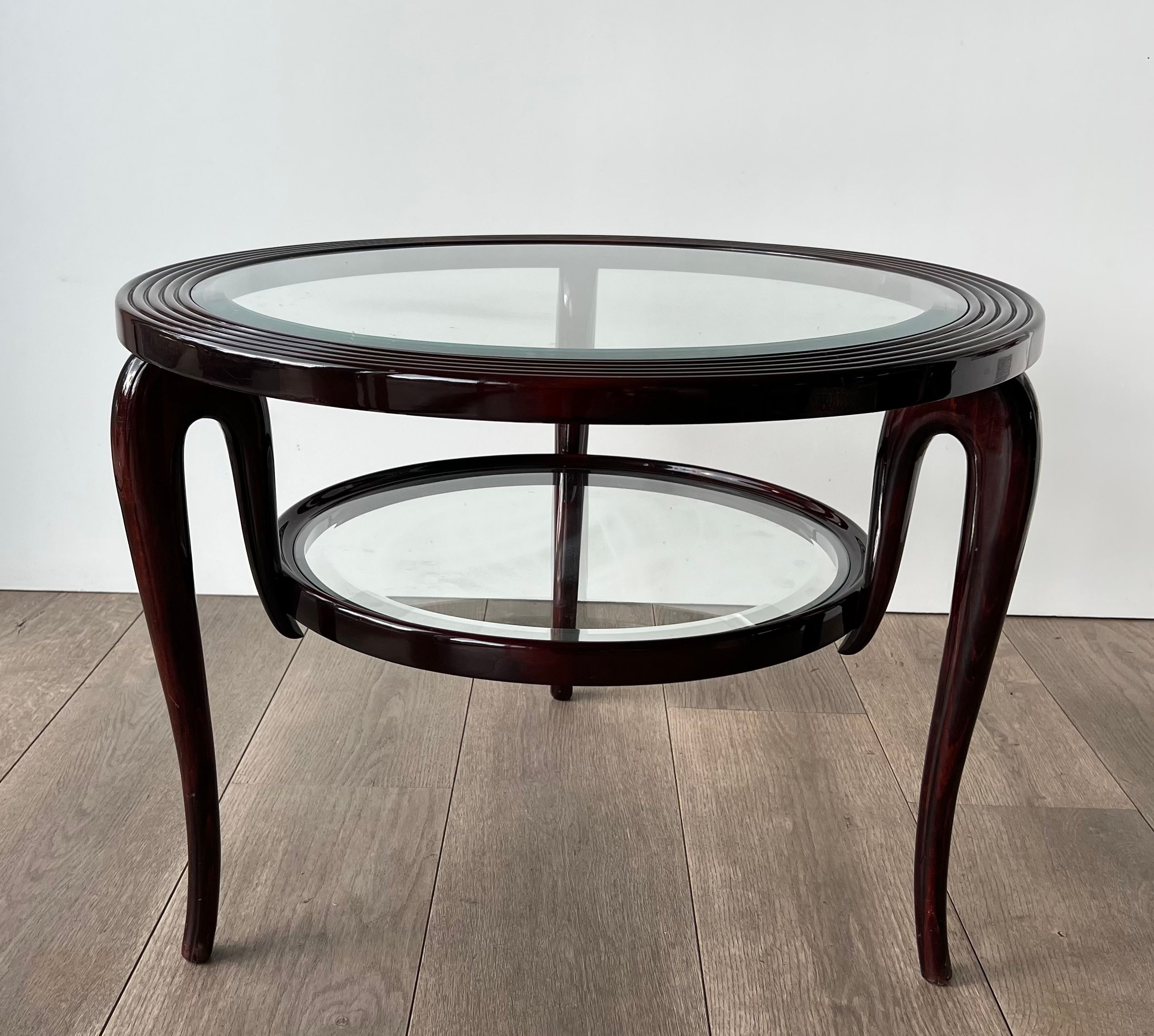Round mid-century coffee table in walnut with a double top by Paolo Buffa.