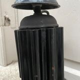 Black industrial pendant light in enameled sheet metal