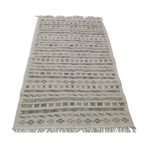 Tapis blanc à motifs multicolores