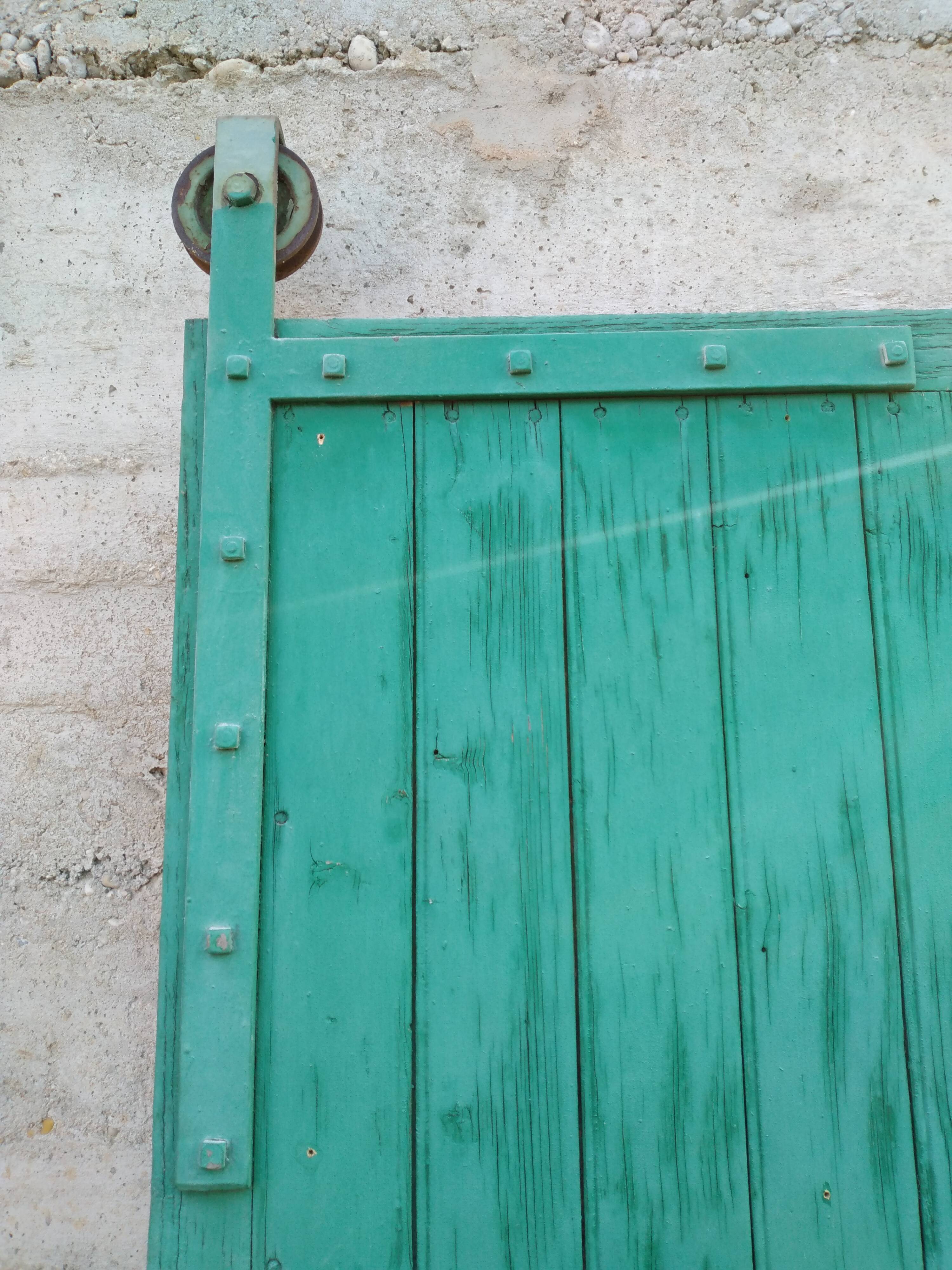 Old wooden door with pulley