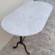 Restaurant bistro table in oval marble and decorated cast iron bases -1m51