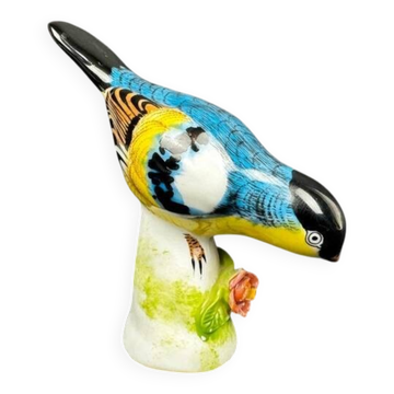 Porcelain figurine of a polychrome bird on a vintage floral base