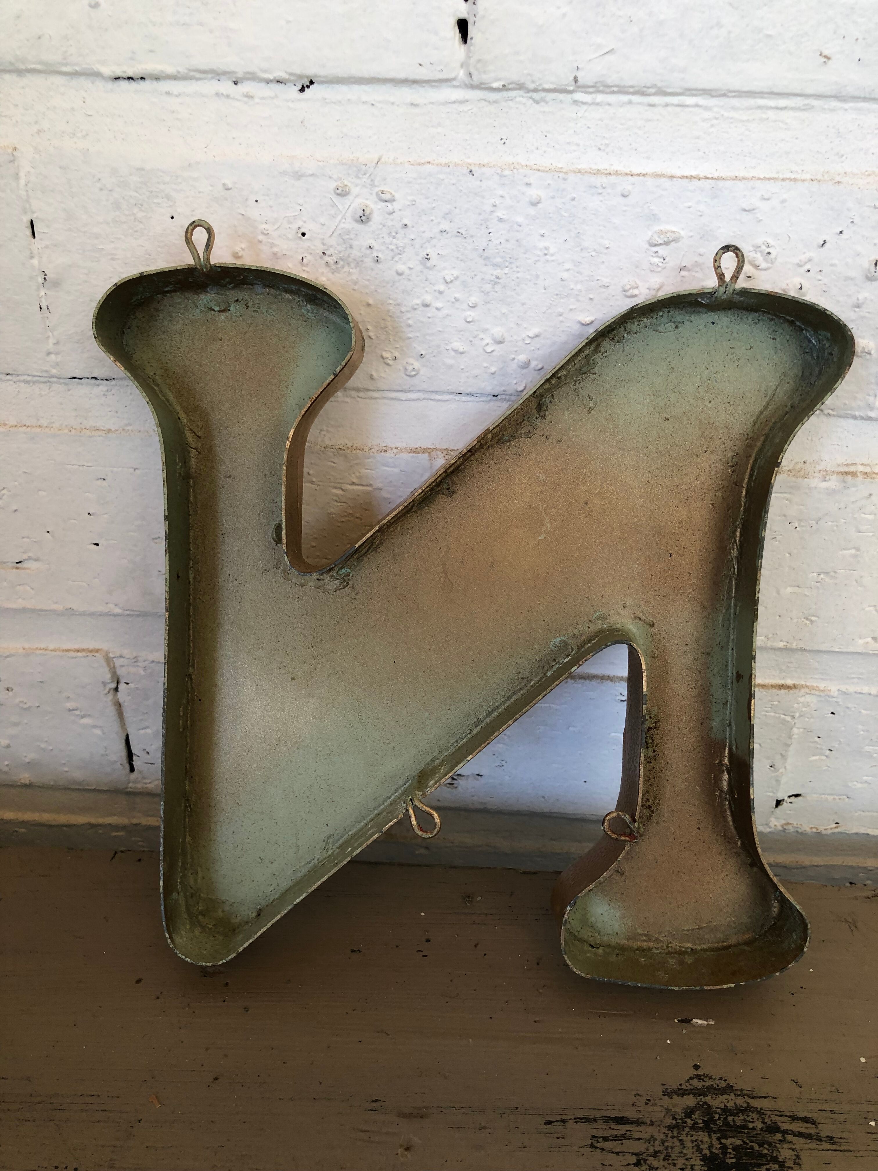 Golden sign letter "N"